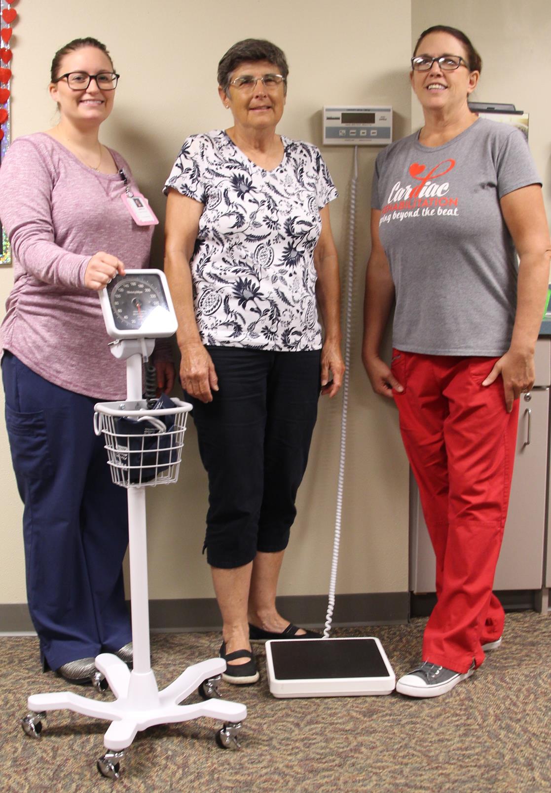 Picture with new cardiac rehab equipment made possible by the Johnson family’s donation are Emily Weets, RN, Donna Johnson, and Trish Jensen, RN.