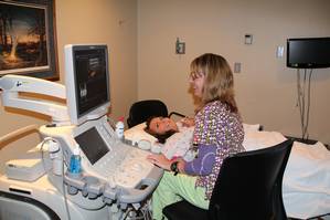 Patient receiving ultrasound at Iowa Specialty Hospitals & Clinics