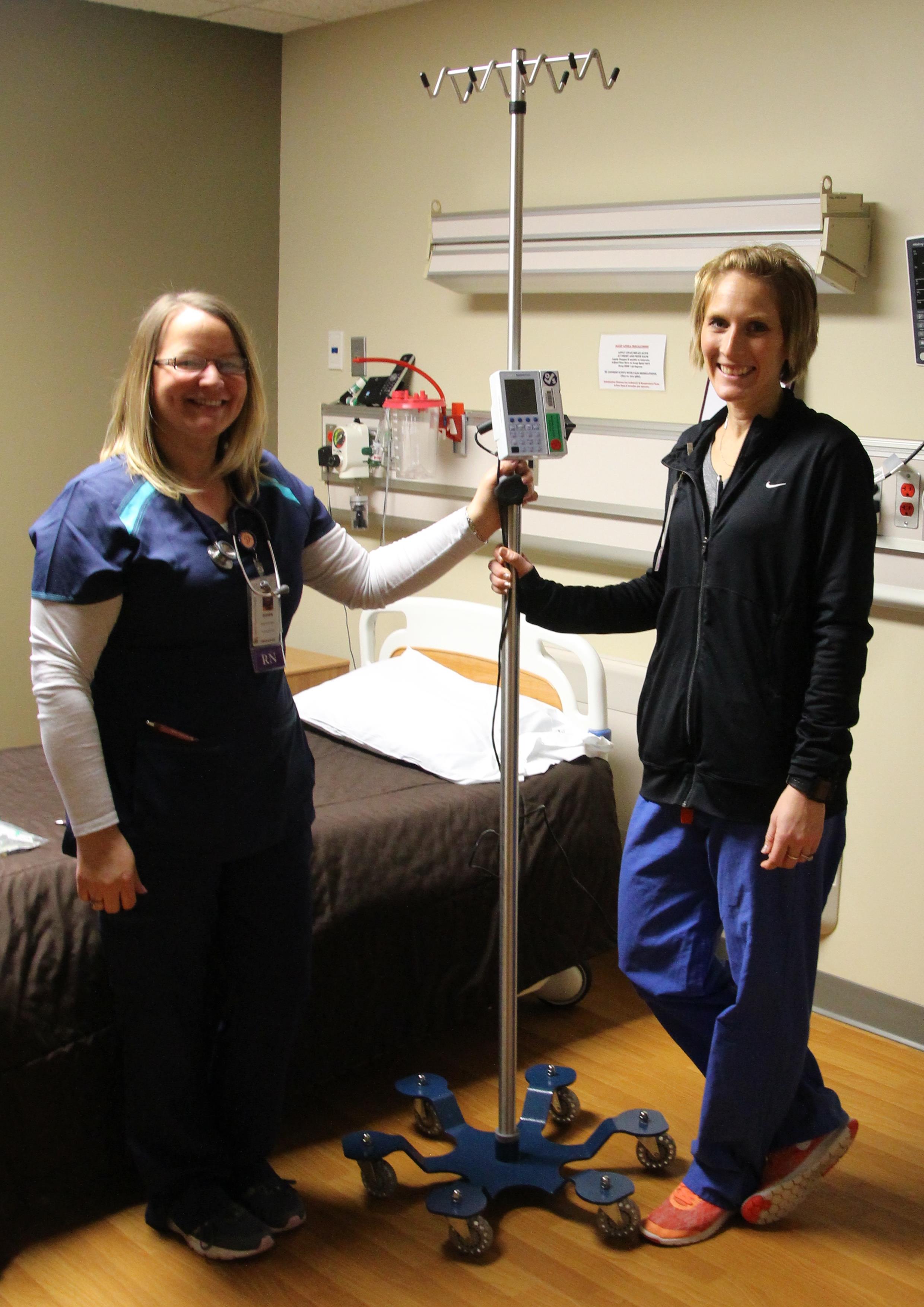 L to R:  Nurses, Dawn Schultz and Amy Bahnsen, pictured with one of the new IV stands made possible in portion by the Wright County Charitable Foundation.