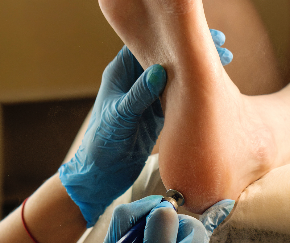 A foot specialist at Iowa Specialty Hospitals and Clinics examining a patient's foot.